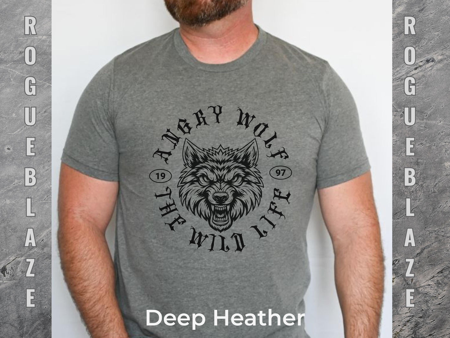 A man wearing a gray t-shirt with a graphic design featuring a wolf's head and the text "Angry Wolf" and "The Wild Life" printed on it.