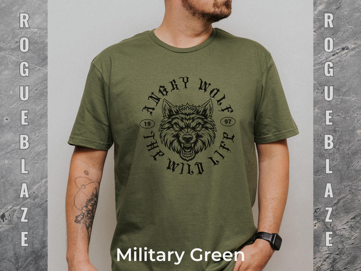 A man wearing a green t-shirt with a graphic of a wolf's head and the text "Angry Wolf" printed on it.